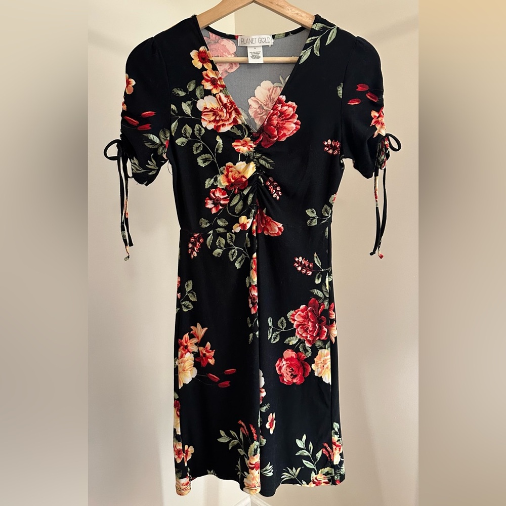 Black V-Neck Ruched Skater Dress with Red and Green Floral Design